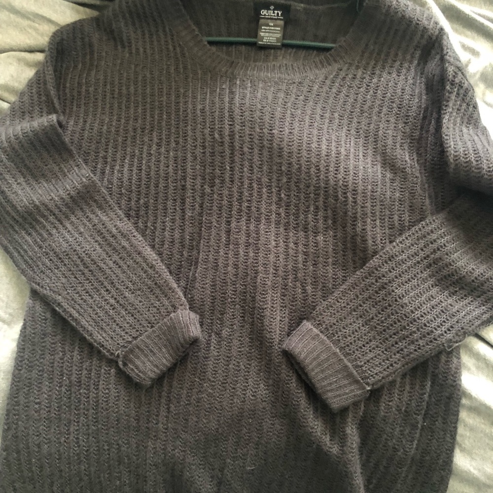 Simple grey sweater with cuffed sleeves.